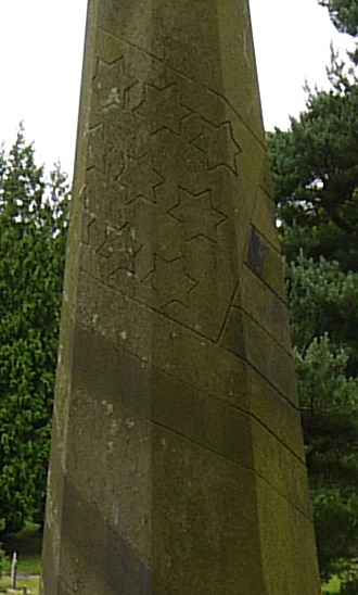 The grave of Armenia Cousins with stars and stripes carved on the column