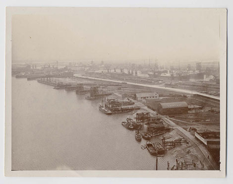 This view from the Transporter Bridge shows the river wharves with the Alexandra Docks beyond soon after 1906