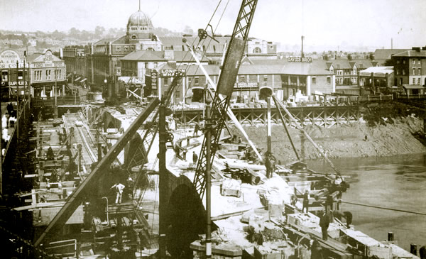 Demolition of the old bridge in progress, it has been taken back to about the same state as it was in 1801 when drawn by Sir Richard Colt Hoare for William Coxe’s An Historical Tour in Monmouthshire.