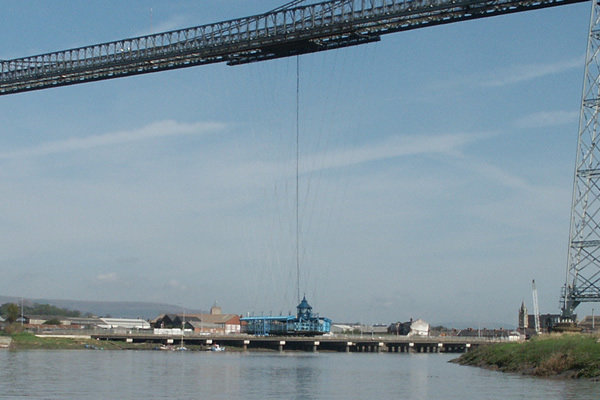 A moving car with 60 steel wheels runs along the top platform, 177ft above the river, and the travelling platform, which is 33ft long and 40ft wide, is suspended from it. Photograph © Newport Past 2010.